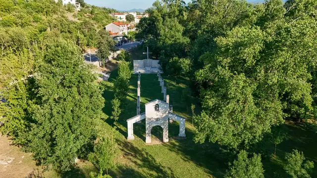 Chapel bell tower among the trees from above