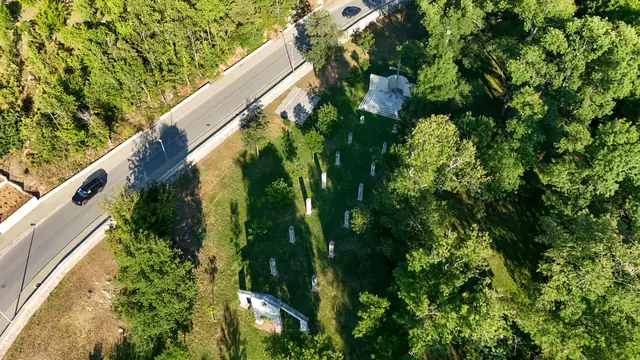 Park with a memorial by the road from above